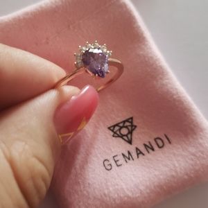 Gold and purple gemstone ring